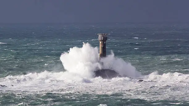 Atlantic waves breaking over Longships Lighthouse off the Cornish coast
